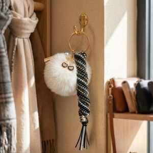 Elegant Gold and Black Keychain with Faux Fur Pom Pom